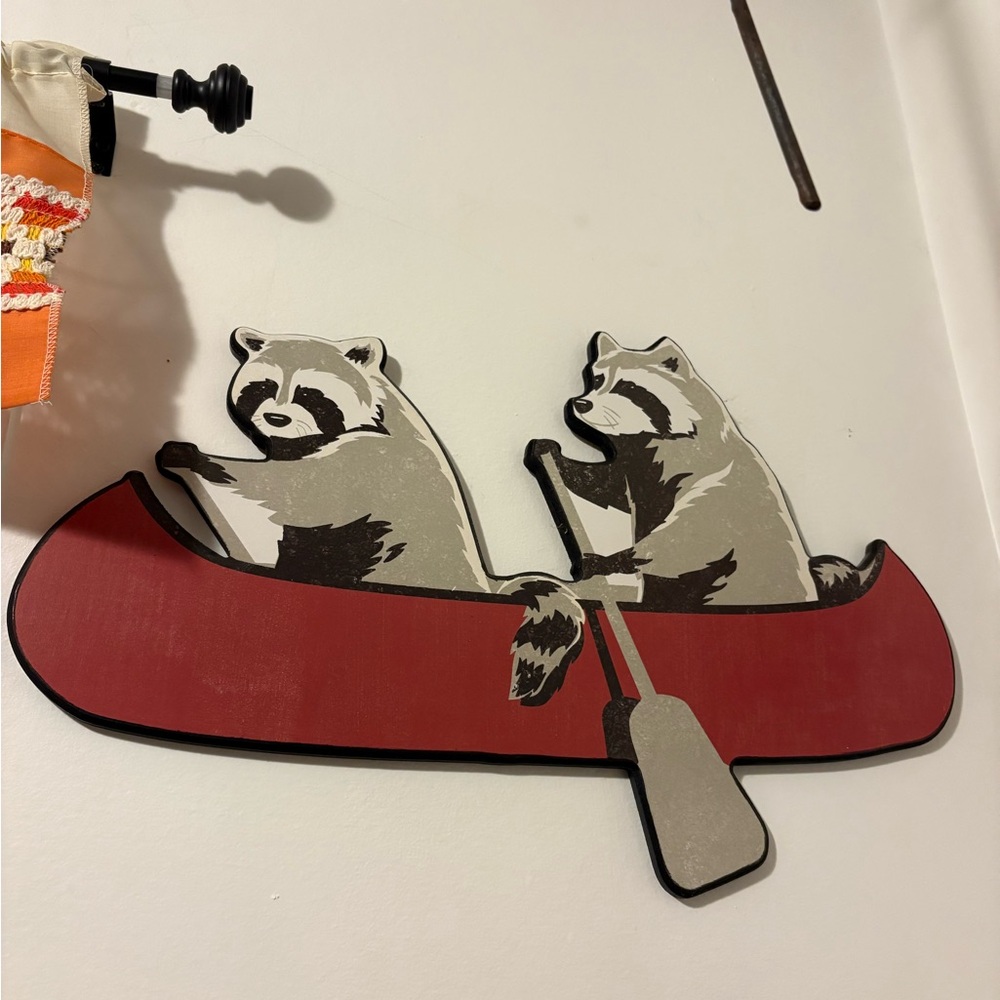 Raccoons in a canoe wall art